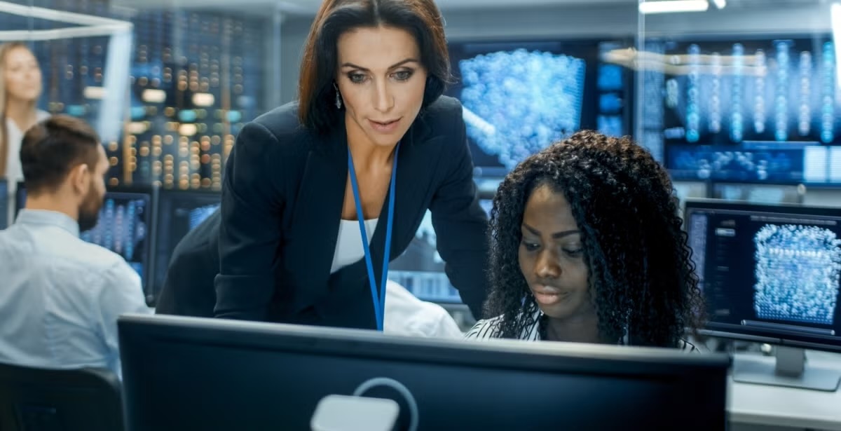 A CTO supervising and discussing in a high-tech office environment.