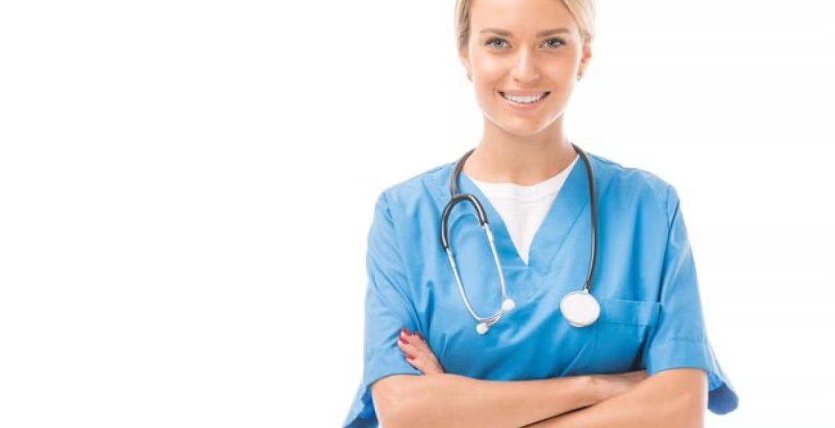 A smiling healthcare worker in scrubs, symbolizing compassion and dedication in the medical profession.