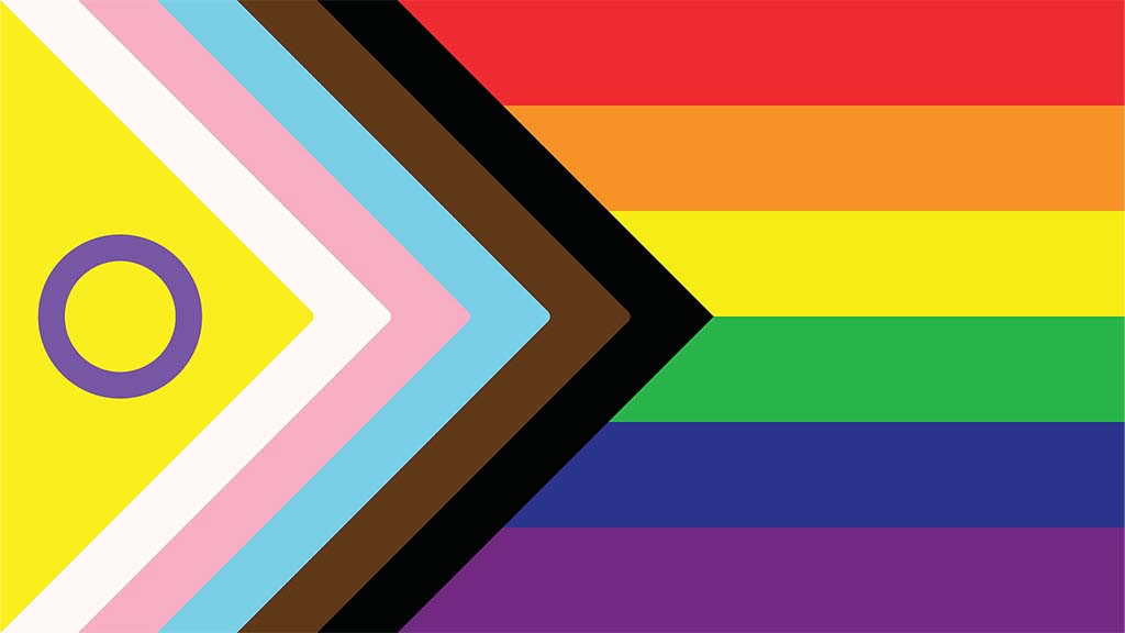 Image of the Progress Pride Flag, featuring the traditional rainbow design with added stripes representing marginalized communities.