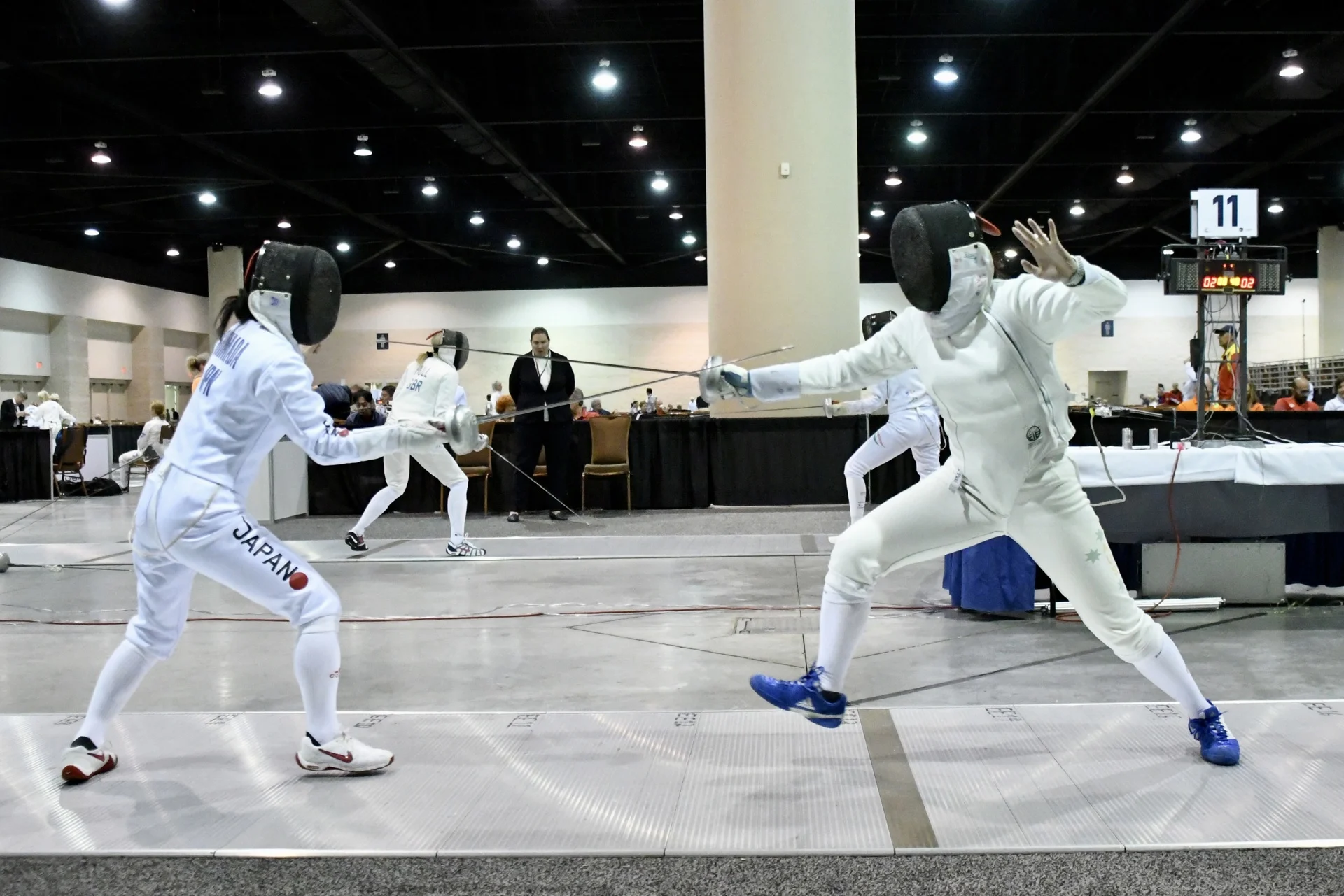 Melissa Yeung (right) in competition at the 2014 Asian Veteran Fencing Championships in Hong Kong. Photo: Dougal Brown.