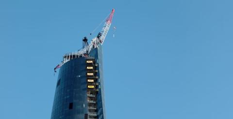 A view of a top of a high-rise skyscraper under construction.