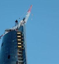 A view of a top of a high-rise skyscraper under construction.