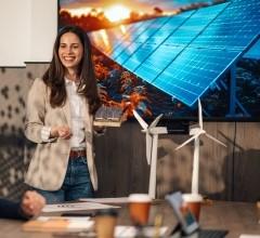 A sustainable energy leader presenting a project about solar panels to a group of people in a meeting.