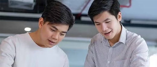 Two men looking at a blueprint