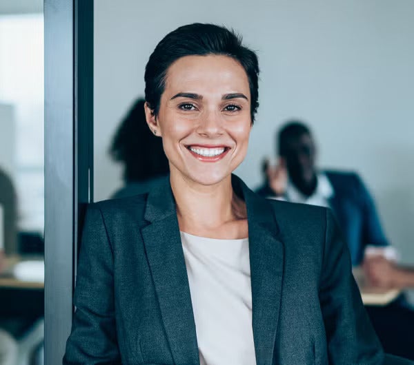 A woman in corporate smiling